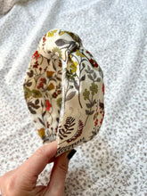 Liberty printed HedgeRow Design, and Ovory base colour, leaves and foliage in greys, muted green, rust and mustards shades.